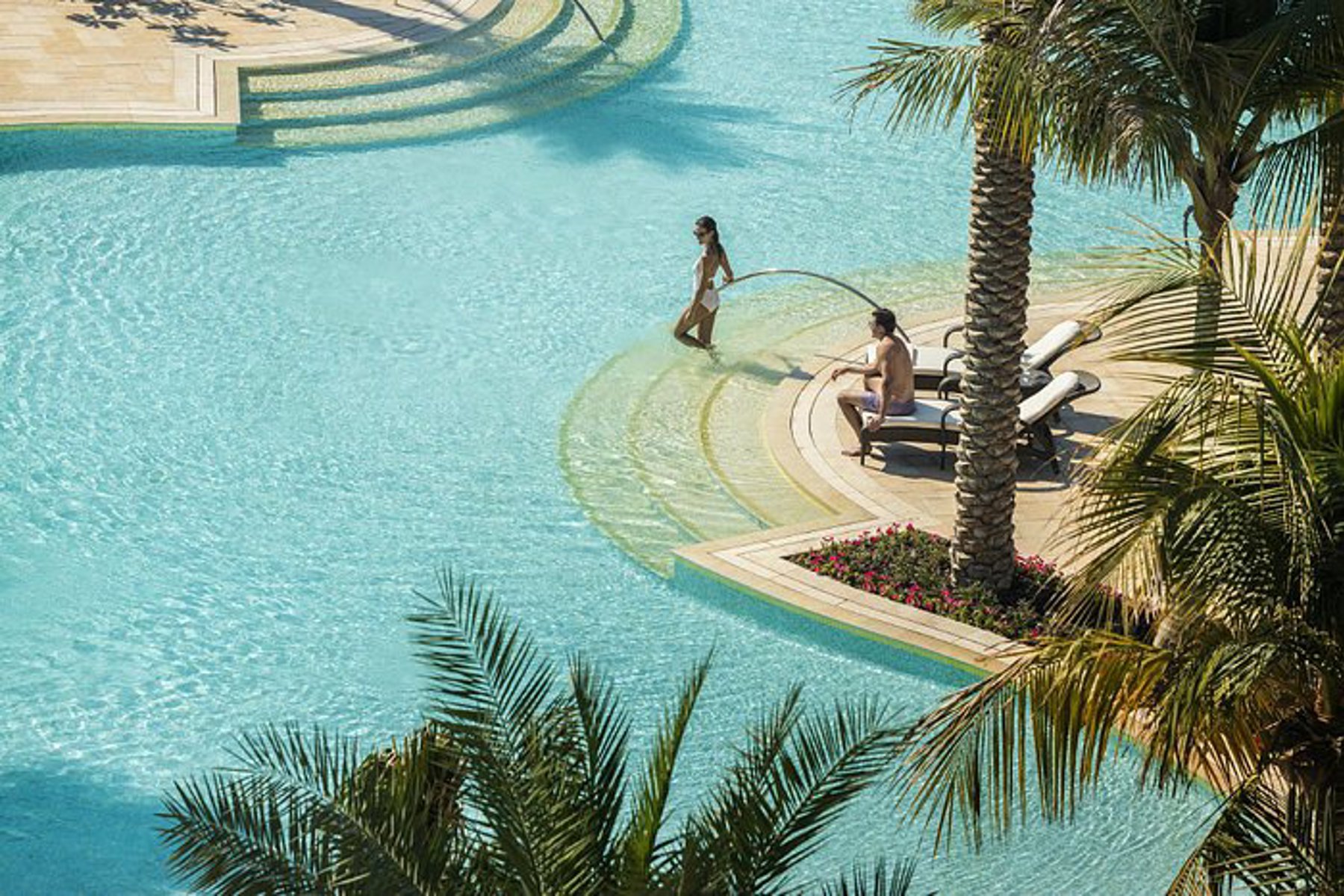 Nakkash Contract Dedon Dubai – premium hospitality hotel pool outdoor furniture with sunbed and umbrella