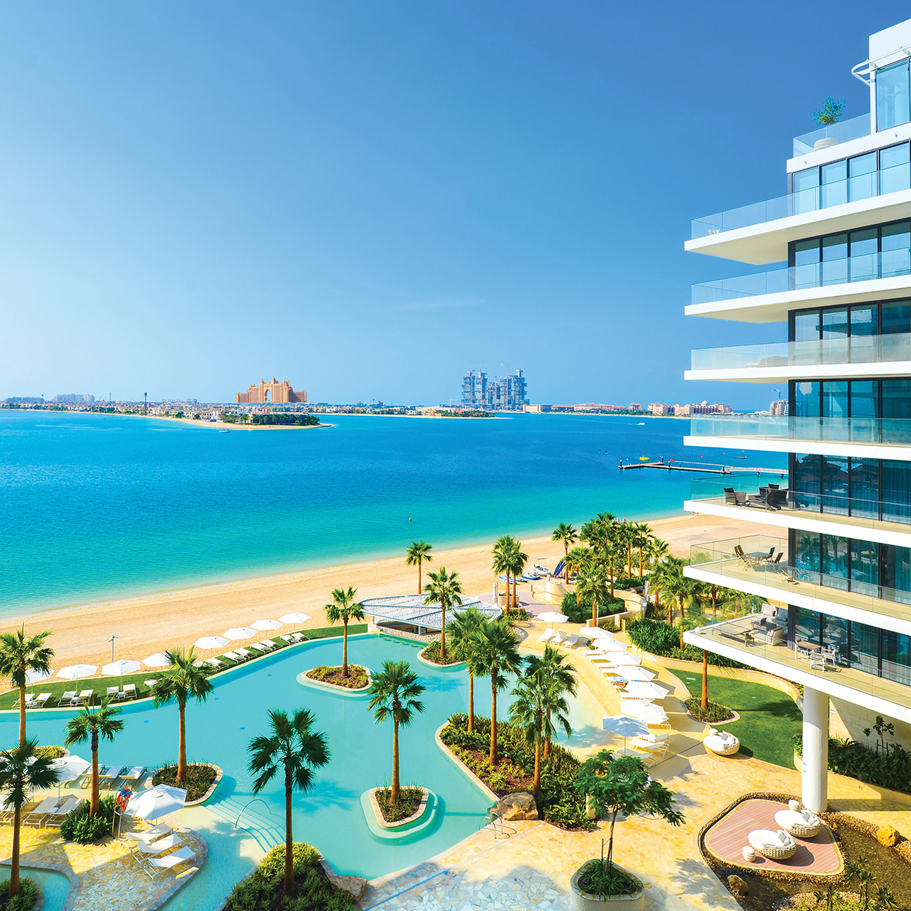 Outdoor sunbeds, loungers, umbrellas and daybeds at Serenia Residences Palm | Nakkash