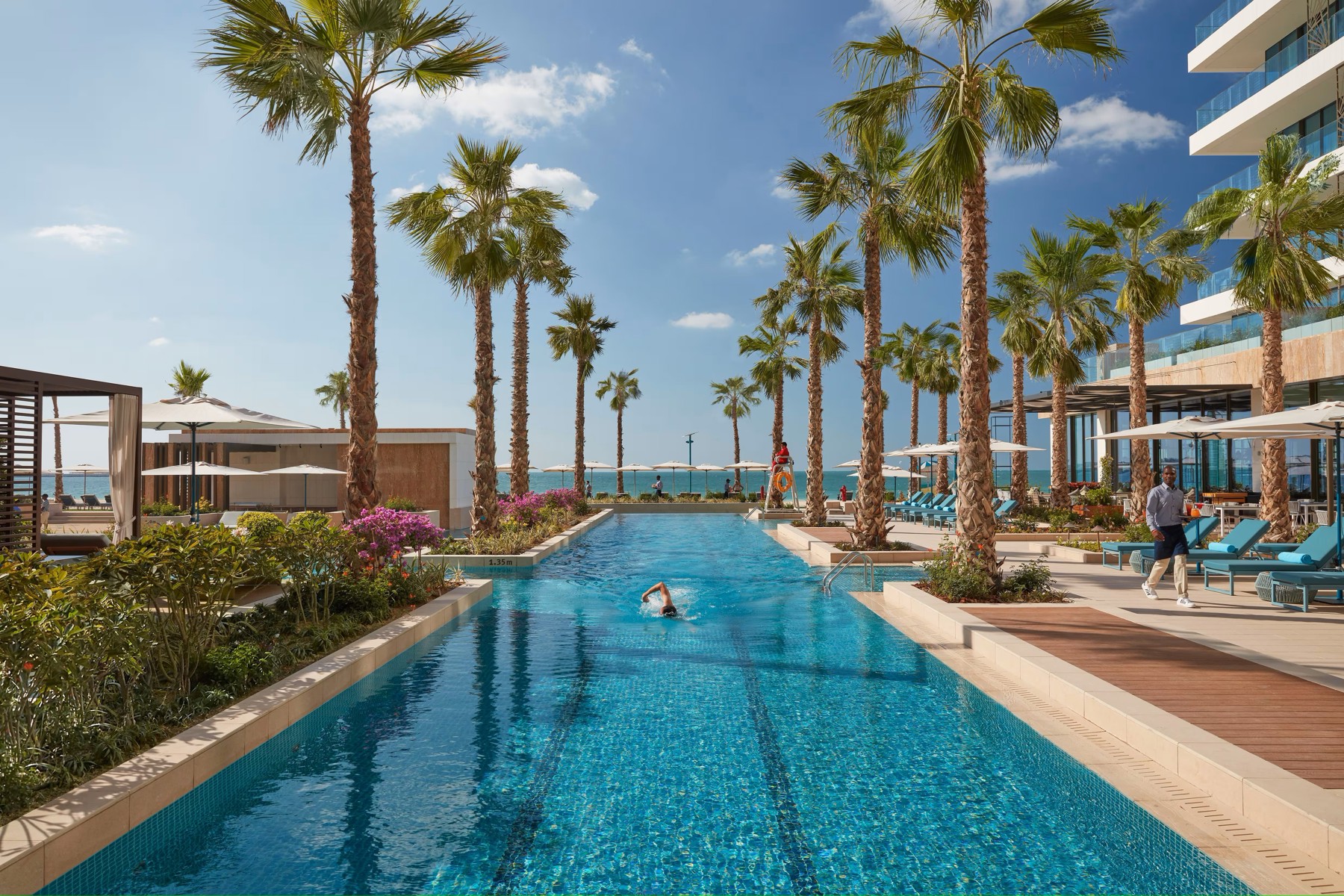 Nakkash Contract Tuuci Manutti Dubai – premium hospitality hotel pool outdoor furniture with sunlounger, umbrella, and tables