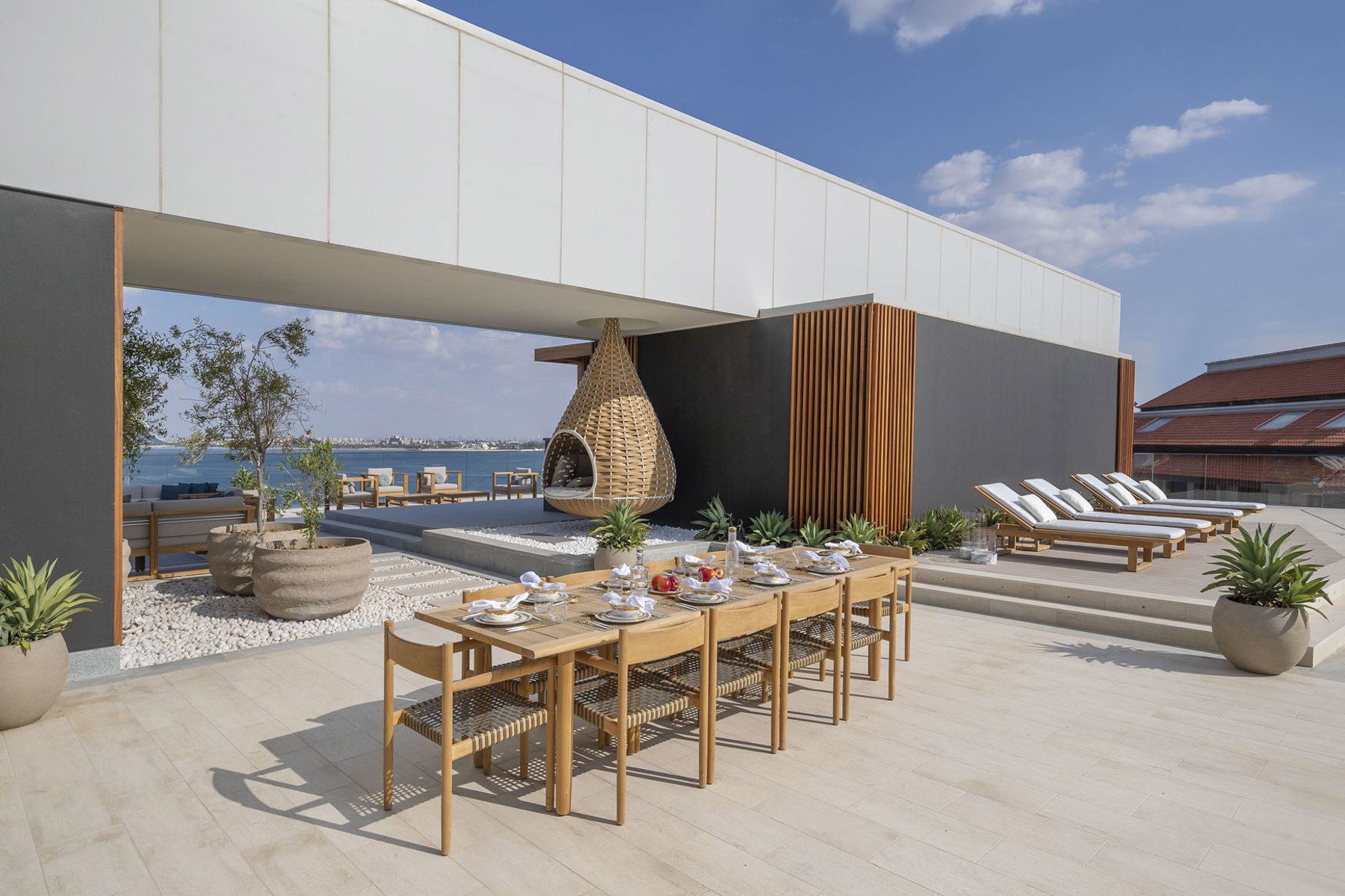 Outdoor sunbeds, loungers, umbrellas and daybeds at Serenia Residences Palm | Nakkash